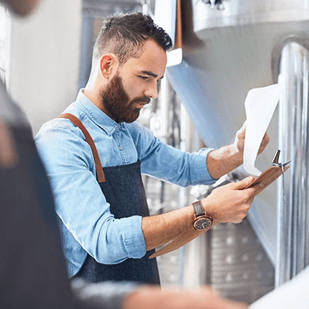 man looking at report