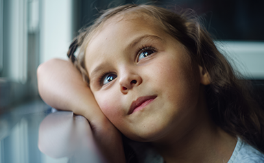 child looking up into sky