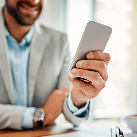 male looking at mobile phone