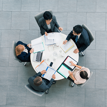 For Companies with: people sitting around conference table