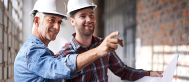 Finance Growth two men with hardhats looking at blueprints