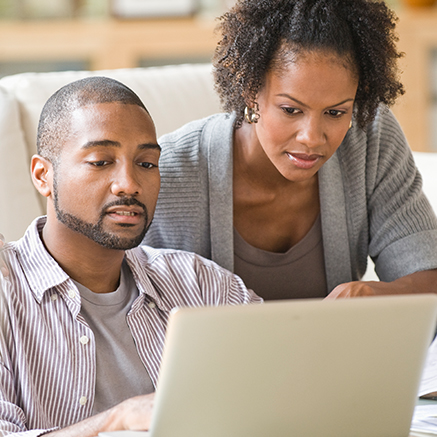 Step 1: Application Couple looking at laptop computer