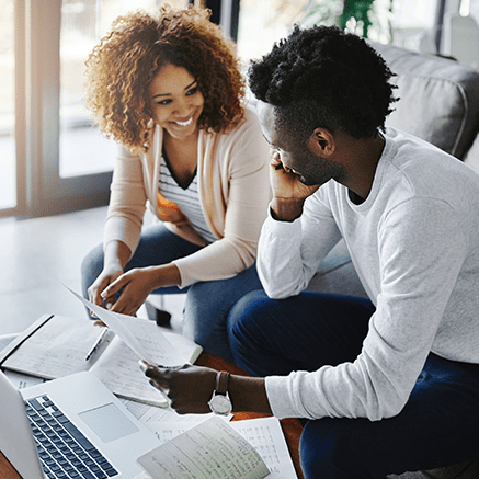 Working with a Specific Banker? couple sitting on couch looking at bank statements