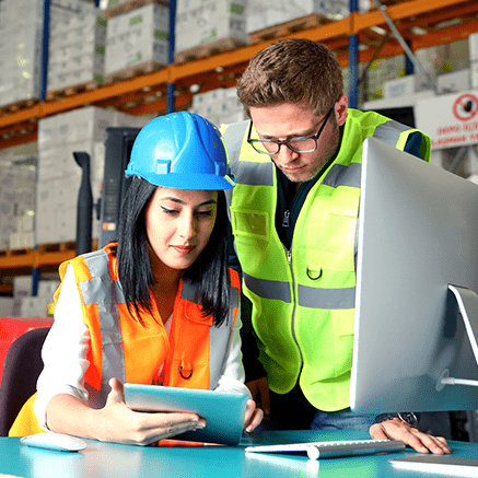 construction workers looking at tablet