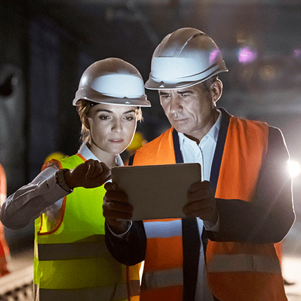 Customized for Your Business female and male with hardhats looking at tablet