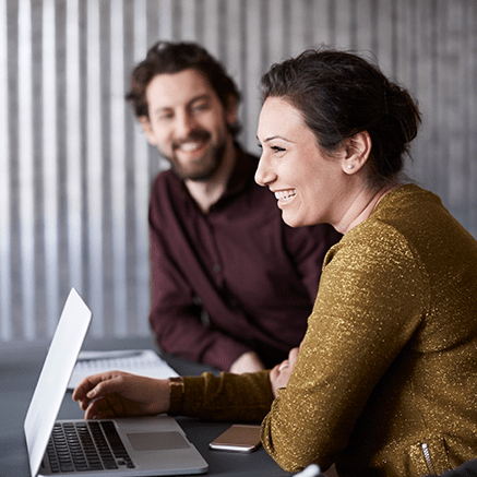 man and woman smiling