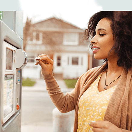 woman using credit card to pay for parking