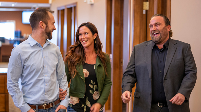 mortgage banker laughing with customer