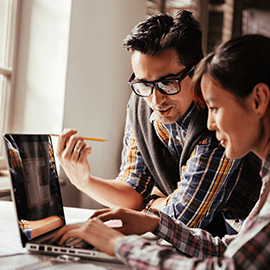 man and woman on laptop 