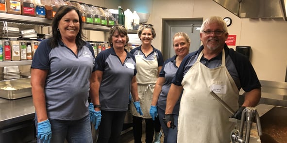 Employees serving at The Banquet