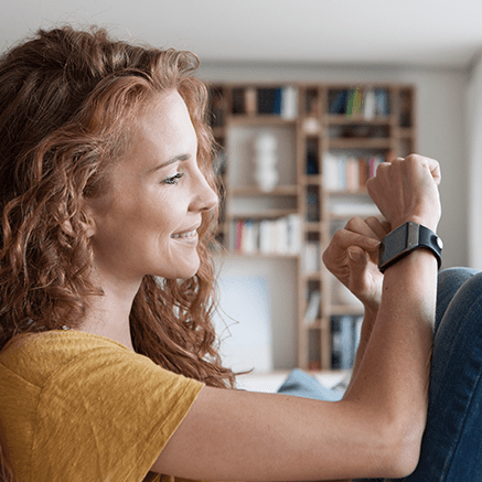 woman using smart watch